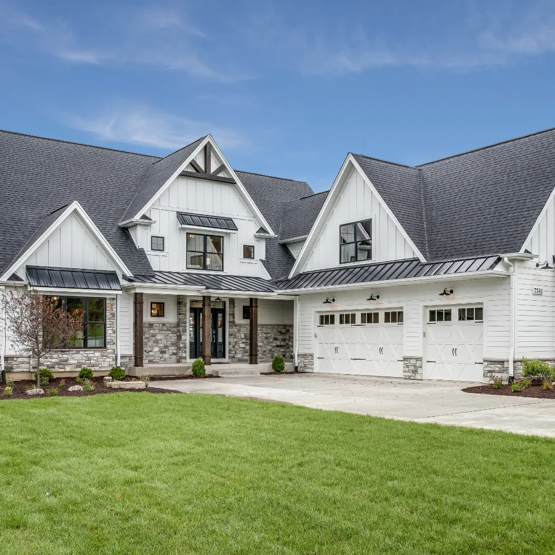 A gray house with a white front door