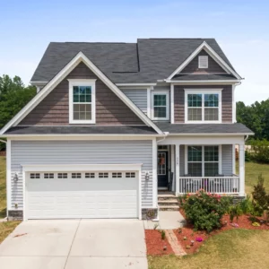 A gray house with a white front door