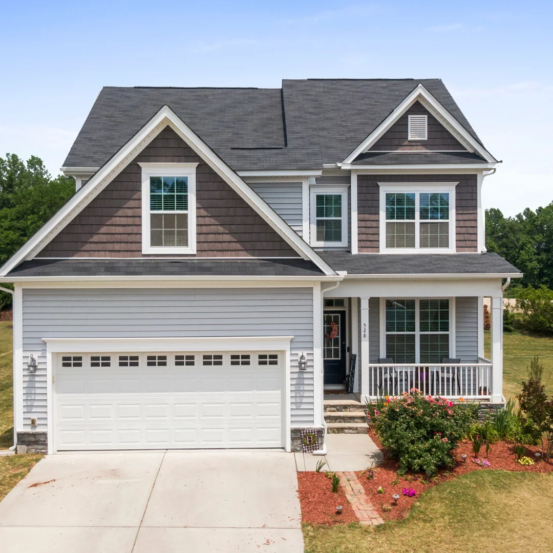 A gray house with a white front door