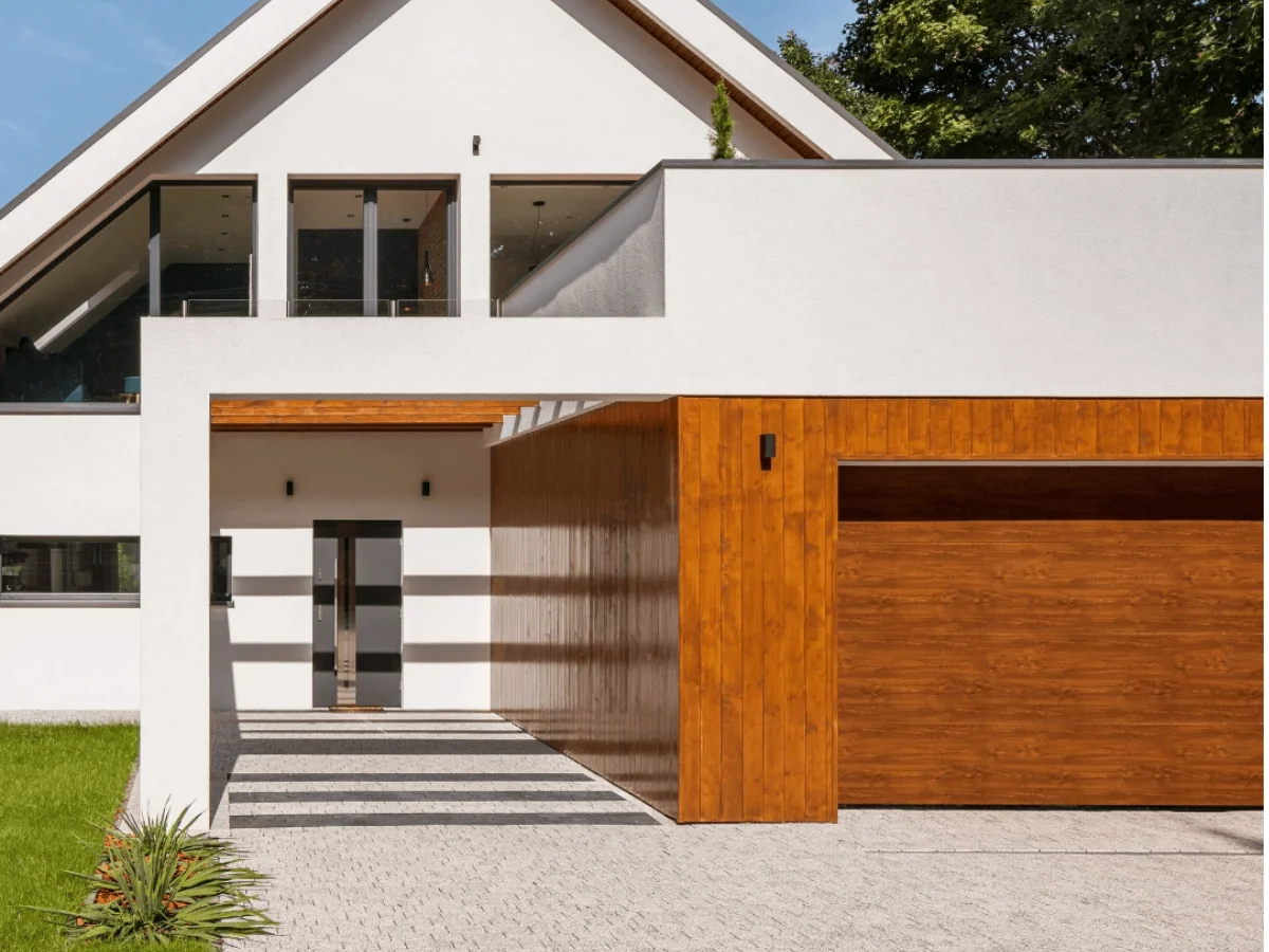 A white house with a wooden garage door style